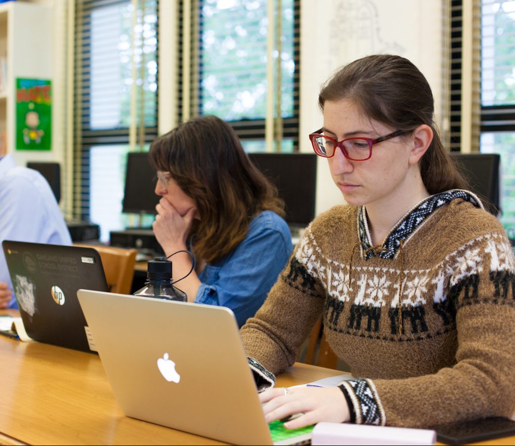 Teachers looking at laptops Teachers looking at laptops