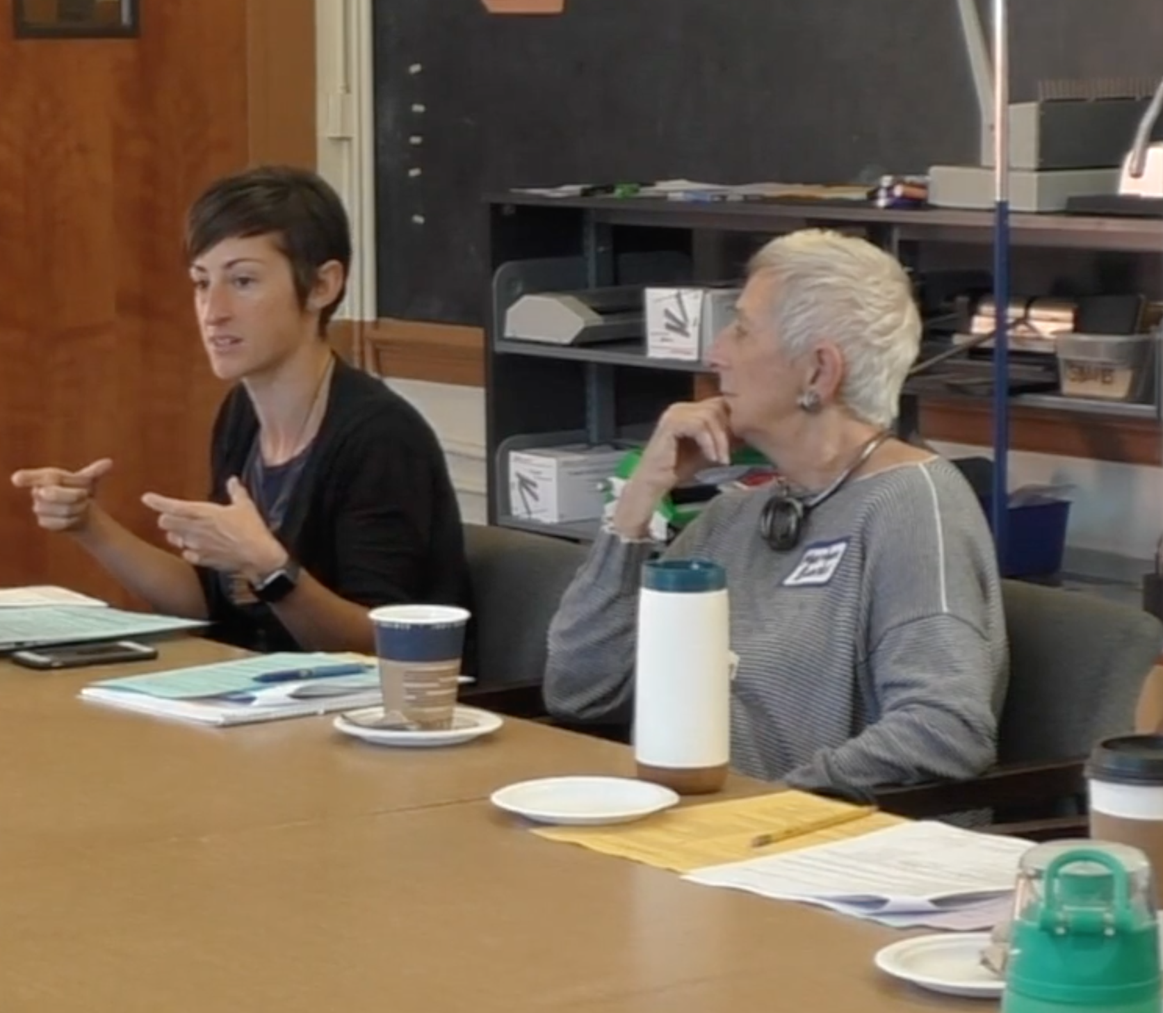 Prelesson discussion 2 One teacher in a pre-lesson discussion speaks as another teacher sitting next to her listens